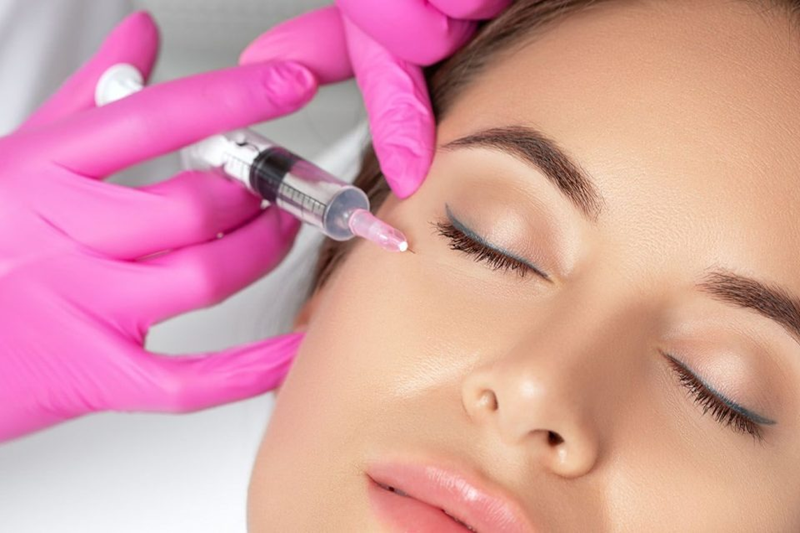 Close-up of a Botox injection near the outer eye for crow's feet softening in a Dubai aesthetic clinic