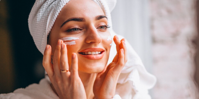 Woman gently applying skincare cream to build tolerance with doctor-guided products