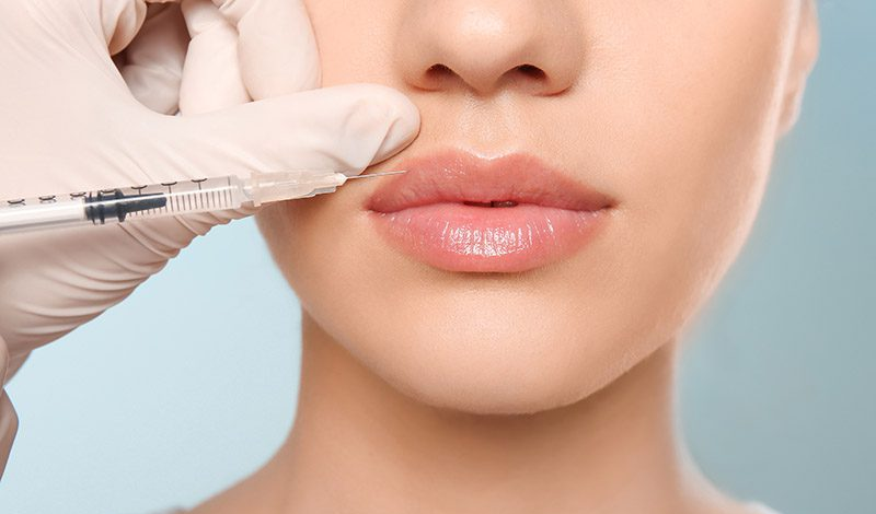 Precise jawline and lower-face filler injection in a sterile Dubai clinic setting