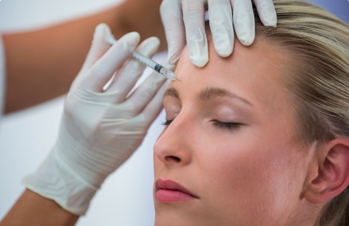 Close-up of a professional Botox injection into the forehead glabella area for wrinkle treatment in Dubai